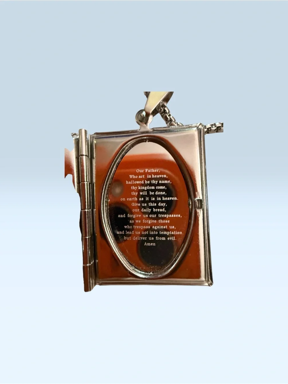 The Lord’s Prayer engraved locket and The Lord’s Prayer engraved ring. Stainless
